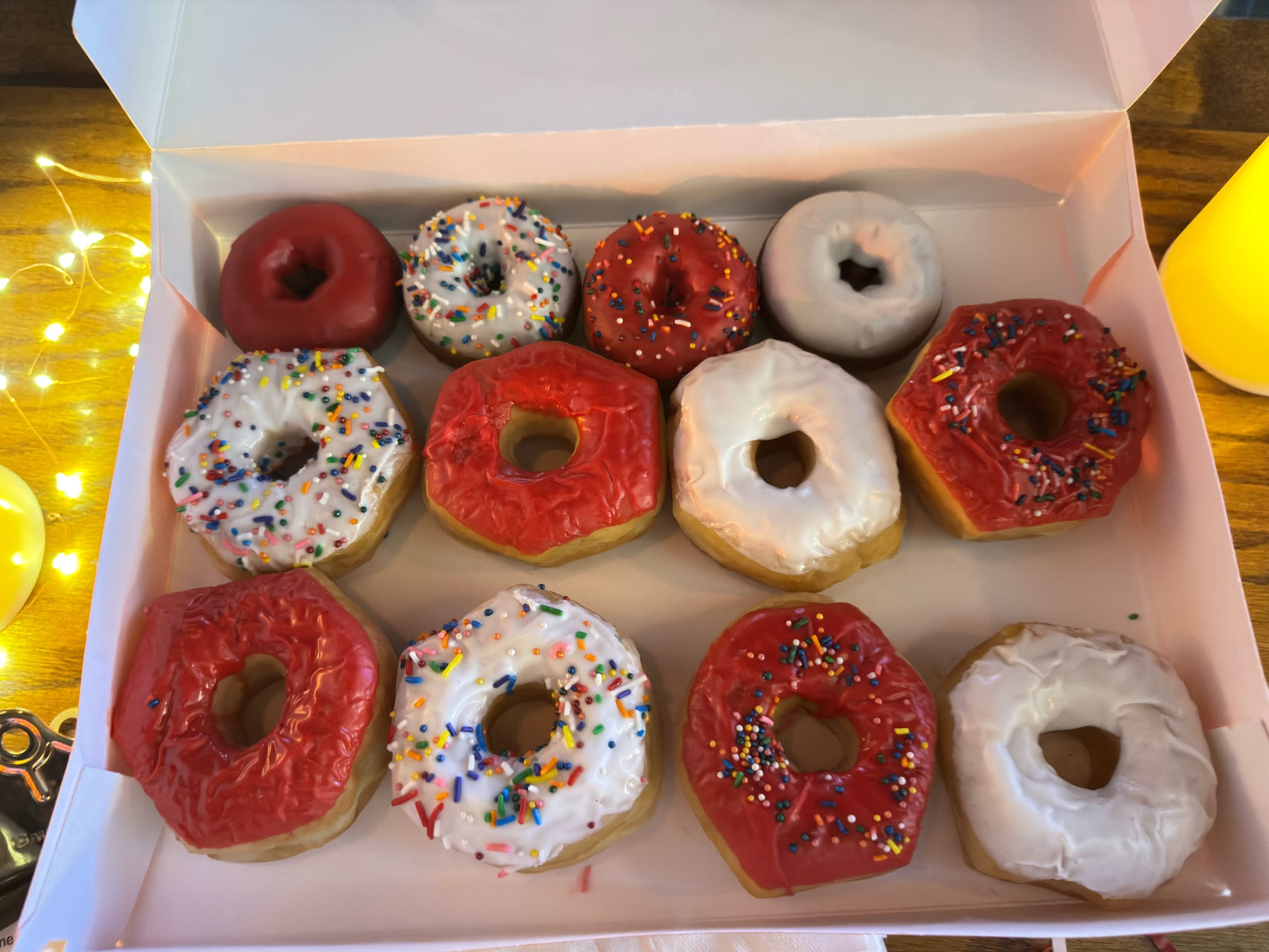 A box of red and white Touchdown Donuts